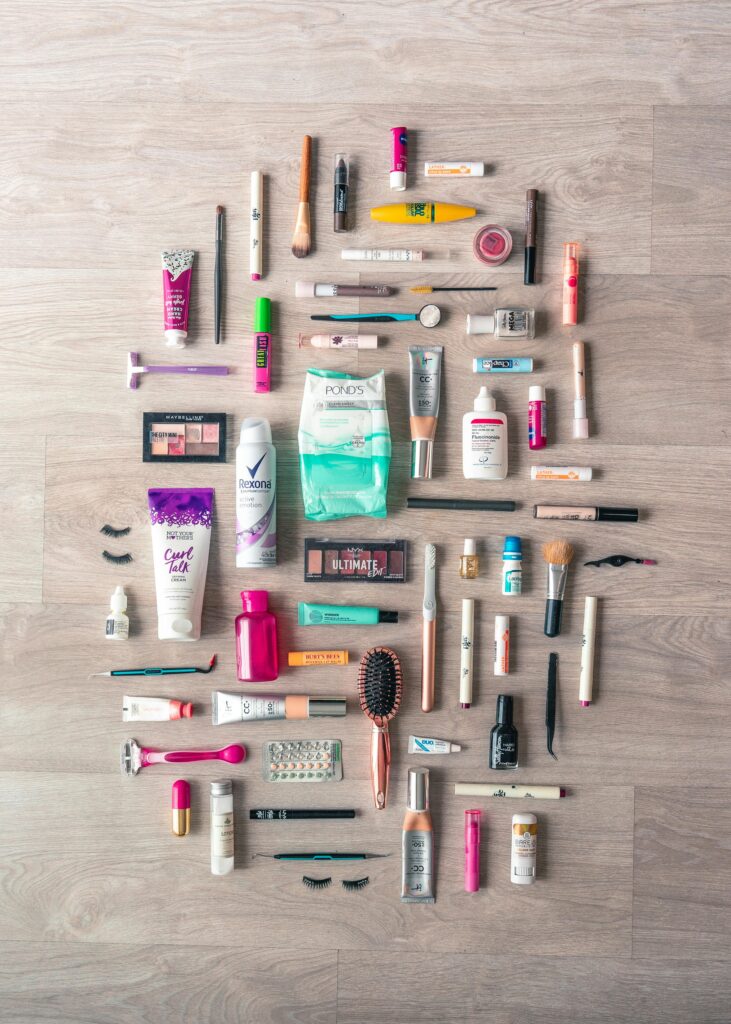 pexels photo 3993398 3993398 A diverse collection of beauty and grooming products neatly arranged on a wooden surface in a flatlay style.